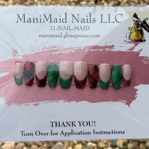 Set of press-on nails in green and red plaid patterns. 
